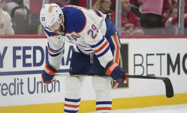 Edmonton Oilers center Leon Draisaitl (29) skates around after the Florida Panthers score their third goal during second period of Game 6 of the NHL hockey Stanley Cup Final Tuesday, June 17, 2025, in Sunrise, Fla. (AP Photo/Lynne Sladky)