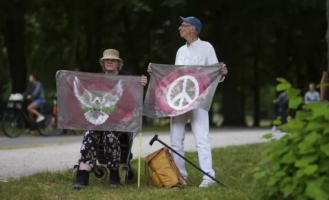 Demonstrators protest against the NATO summit in The Hague, Netherlands, Wednesday, June 25, 2025. (AP Photo/Peter Dejong)
