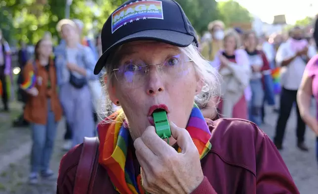A protester takes part in a LTGBQ rally against the participation of the US President Donald Trump and Hungarian Prime Minister Viktor Orban at the NATO summit in The Hague, Netherlands, Tuesday, June 24, 2025. (AP Photo/Patrick Post)