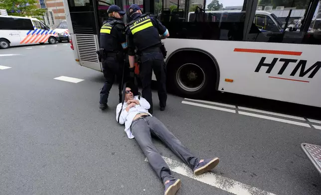 Police detain a protester during a rally against the NATO summit in The Hague, Netherlands, Wednesday, June 25, 2025. (AP Photo/Patrick Post)