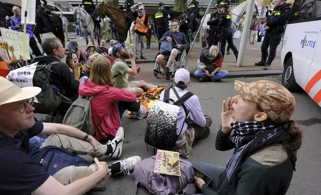 Police block demonstrators who are protesting against the NATO summit in The Hague, Netherlands, Wednesday, June 25, 2025. (AP Photo/Patrick Post)