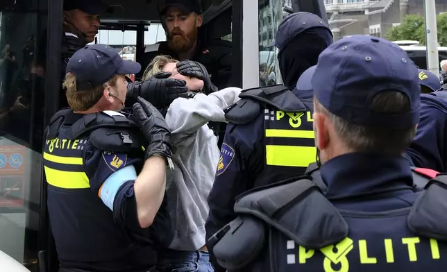 Police detain a protester during a rally against the NATO summit in The Hague, Netherlands, Wednesday, June 25, 2025. (AP Photo/Patrick Post)