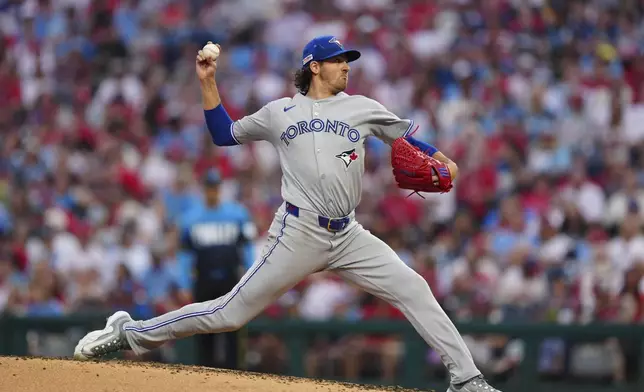Toronto Blue Jays pitcher Kevin Gausman throws during the third inning of a baseball game against the Philadelphia Phillies, Friday, June 13, 2025, in Philadelphia. (AP Photo/Derik Hamilton)