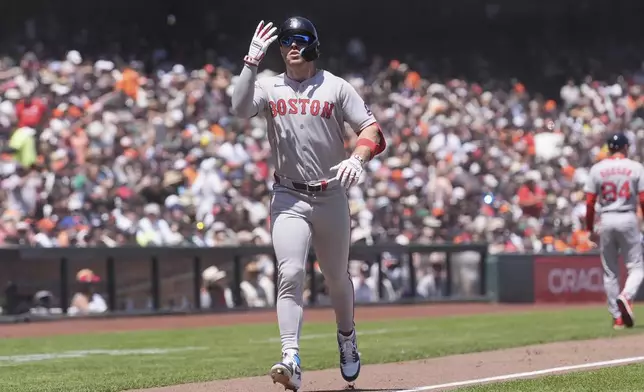 Boston Red Sox's Romy Gonzalez celebrates after hitting a home run against the San Francisco Giants during the fifth inning of a baseball game in San Francisco, Sunday, June 22, 2025. (AP Photo/Jeff Chiu)