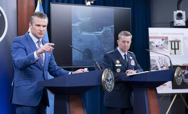 Defense Secretary Pete Hegseth, left, speaks at a news conference with Joint Chiefs Chairman Gen. Dan Caine at the Pentagon, Thursday, June 26, 2025 in Washington. (AP Photo/Kevin Wolf)