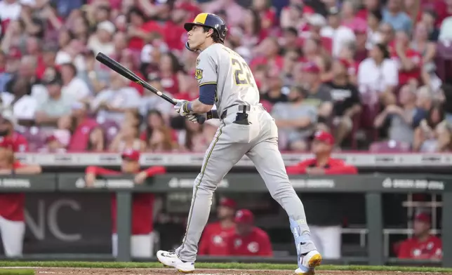 Milwaukee Brewers' Christian Yelich watches his solo home run during the third inning of a baseball game against the Cincinnati Reds, Monday, June 2, 2025, in Cincinnati. (AP Photo/Jeff Dean)