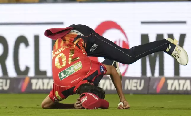 Punjab Kings' Marco Jansen takes a catch to dismiss Royal Challengers Bengaluru's Virat Kohli during their Indian Premier League cricket match in Bengaluru, India, Friday, April 18, 2025. (AP Photo/Aijaz Rahi)