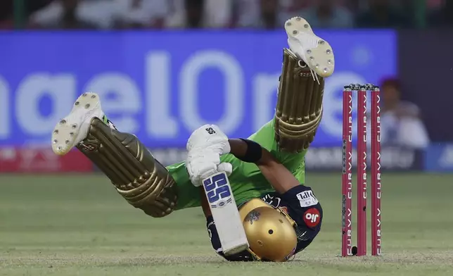 Royal Challengers Bengaluru's Devdutt Padikkal loses his balance as he plays a shot during the Indian Premier League cricket match against Rajasthan Royals in Jaipur, India, Sunday, April 13, 2025. (AP Photo)