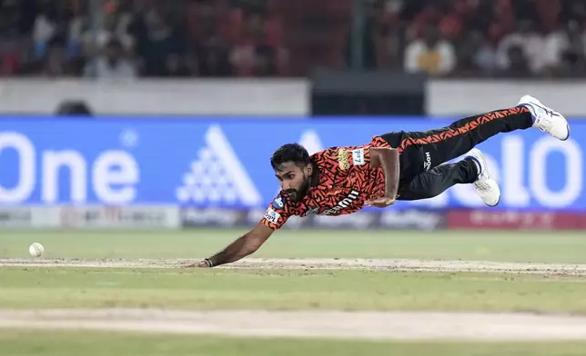 Sunrisers Hyderabad's Eshan Malinga dives to field the ball during the Indian Premier League cricket match against Punjab Kings in Hyderabad, India, Saturday, April 12, 2025. (AP Photo/Mahesh Kumar A.)