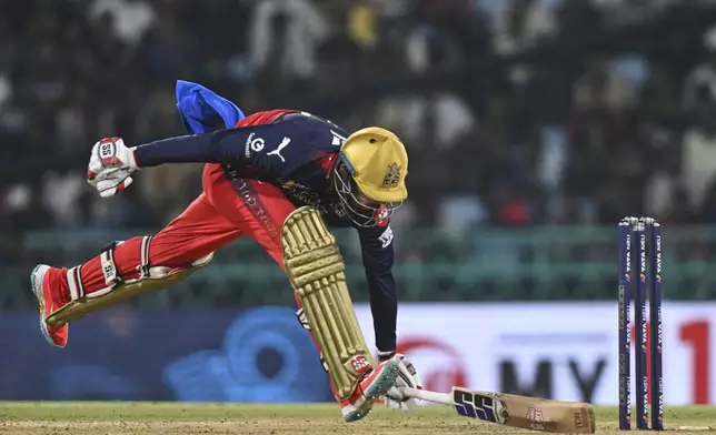 Royal Challengers Bengaluru's Jitesh Sharma successfully completes a run during the Indian Premier League cricket match against Lucknow Super Giants in Lucknow, India, Tuesday, May 27, 2025. (AP Photo)