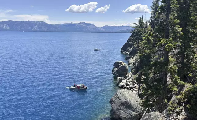 Authorities conduct searches along the shore at D.L. Bliss State Park after a weekend incident in which a boat capsized, killing several people, on Monday, June 23, 2025, in South Lake Tahoe, Calif. (AP Photo/Brooke Hess-Homeier)