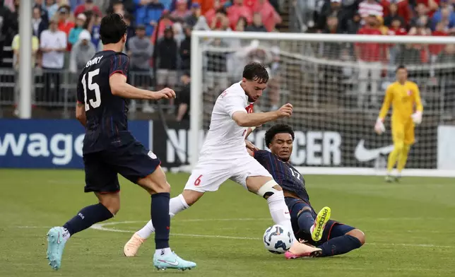 Turkey midfielder Orkun Kökçü (6) controls the ball ahead of United States midfielder Malik Tillman (17) as midfielder Johnny Cardoso (15) looks on during the first half of an international friendly soccer game, Saturday, June 7, 2025, in East Hartford, Conn. (AP Photo/Mary Schwalm)
