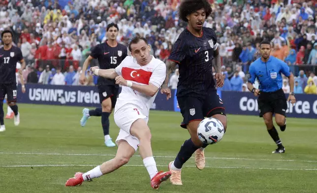 Turkey forward Kerem Aktürkoglu (7) shoots on goal ahead of United States defender Chris Richards (3) during the first half of an international friendly soccer game, Saturday, June 7, 2025, in East Hartford, Conn. (AP Photo/Mary Schwalm)