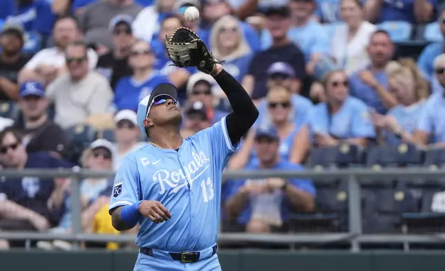 Kansas City Royals first baseman Salvador Perez catches a fly foul ball for the out on Detroit Tigers' Kerry Carpenter during the first inning of a baseball game, Saturday May 31, 2025, in Kansas City, Mo. (AP Photo/Charlie Riedel)