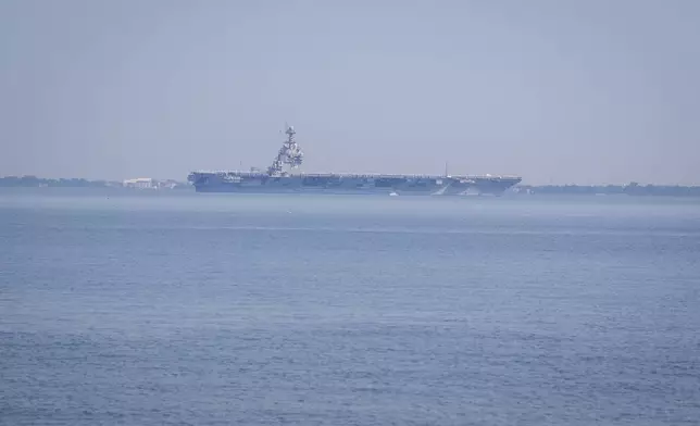 The USS Gerald R. Ford aircraft carrier leaves Naval Station Norfolk, Tuesday, June 24, 2025, in Norfolk, Va. (AP Photo/John Clark)
