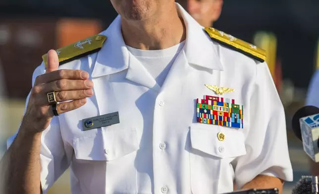 Rear Adm. Paul Lanzilotta, Commander, Carrier Strike Group 12, gives remarks as the USS Gerald R. Ford aircraft carrier makes final preparations to leave Naval Station Norfolk, Tuesday, June 24, 2025, in Norfolk, Va. (AP Photo/John Clark)