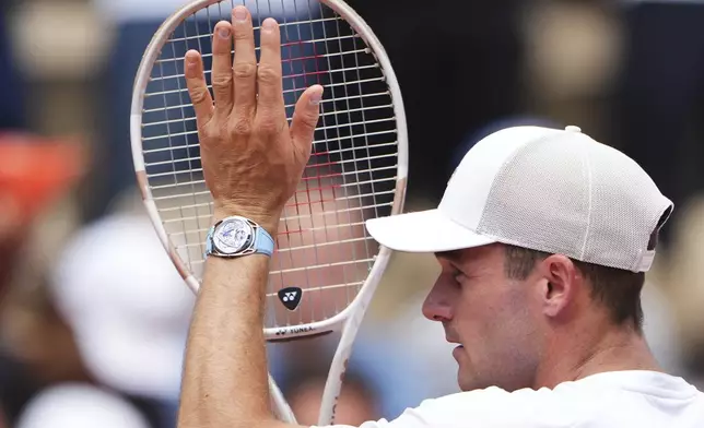Tommy Paul of the U.S. reacts after beating Australia's Alexei Popyrin during their fourth round match of the French Tennis Open, at the Roland-Garros stadium, in Paris, Sunday, June 1 2025. (AP Photo/Lindsey Wasson)
