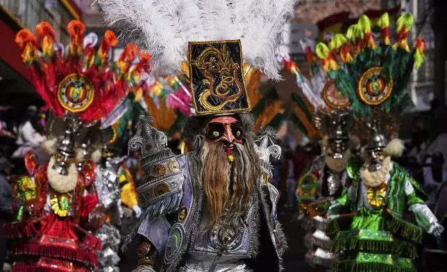 Dancers perform in the annual parade honoring "The Lord of Great Power", in La Paz, Bolivia, Saturday, June 14, 2025. (AP Photo/Juan Karita)