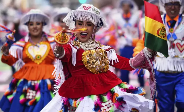 Dancers perform in the annual parade honoring "The Lord of Great Power", in La Paz, Bolivia, Saturday, June 14, 2025. (AP Photo/Juan Karita)