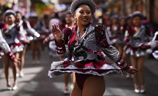 Dancers perform in the annual parade honoring "The Lord of Great Power", in La Paz, Bolivia, Saturday, June 14, 2025. (AP Photo/Juan Karita)