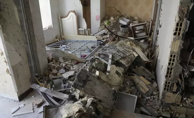 Damages of a building are seen in Tehran, Iran, Wednesday, June 25, 2025, after an Israeli strike on early Tuesday. (AP Photo/Vahid Salemi)