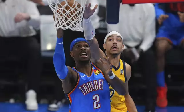 Oklahoma City Thunder guard Shai Gilgeous-Alexander, left, shoots against Indiana Pacers guard Andrew Nembhard during the second half of Game 7 of the NBA Finals basketball series Sunday, June 22, 2025, in Oklahoma City. (AP Photo/Nate Billings)
