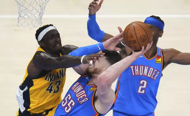 Indiana Pacers forward Pascal Siakam (43) defends against Oklahoma City Thunder center Isaiah Hartenstein (55) during the first half of Game 7 of the NBA Finals basketball series Sunday, June 22, 2025, in Oklahoma City. (AP Photo/Julio Cortez)