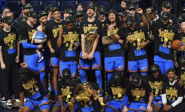 Oklahoma City Thunder players celebrate after winning the NBA basketball championship with a Game 7 victory against the Indiana Pacers Sunday, June 22, 2025, in Oklahoma City. (AP Photo/Nate Billings)
