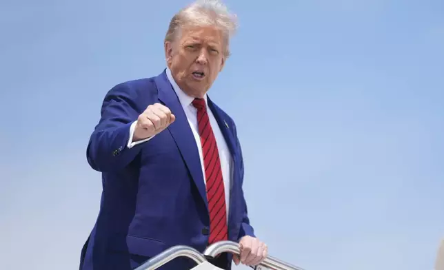 President Donald Trump gestures as he boards Air Force One at Joint Base Andrews, Md., Friday, June 20, 2025. (AP Photo/Manuel Balce Ceneta)