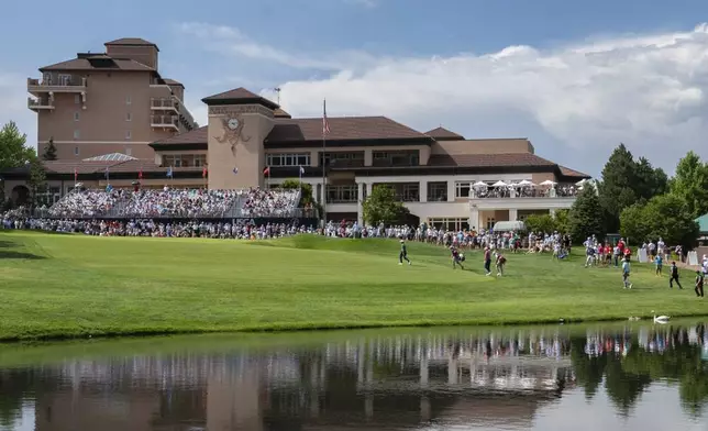 Leaders Mark Hensby, Stewart Cink and Padraig Harrington walk onto the 18th green during the third round of the U.S. Senior Open Championship golf tournament Saturday, June 28, 2025, at the Broadmoor in Colorado Springs, Colo. (Christian Murdock/The Gazette via AP)