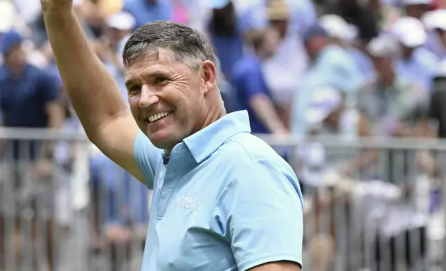 Padragh Harrington waves his hat to the crowd after winning the U.S. Senior Open golf championship at the Broadmoor Golf Club, Sunday, June 29, 2025, in Colorado Springs, Colo. (Jerilee Bennet/The Gazette via AP)
