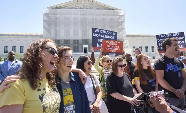 Activists with the Poor People's Campaign protest against spending reductions across Medicaid, food stamps and federal aid in President Donald Trump's spending and tax bill being worked on by Senate Republicans this week, outside the Supreme Court in Washington, Monday, June 2, 2025. (AP Photo/J. Scott Applewhite)