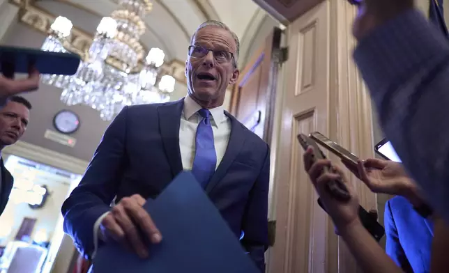 Senate Majority Leader John Thune, R-S.D., pauses in the door of his office to answer questions from reporters about his strategy to advance President Donald Trump's spending and tax bill, at the Capitol in Washington, Monday, June 2, 2025. (AP Photo/J. Scott Applewhite)