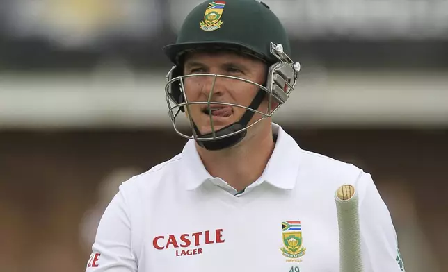 FILE - South Africa's captain Graeme Smith walks back to the players pavilion after dismissed by Australia's bowler Ryan Harris, for 9 runs on the first day of their 2nd cricket test match at St George's Park in Port Elizabeth, South Africa, Thursday, Feb. 20, 2014. (AP Photo/Themba Hadebe, File)