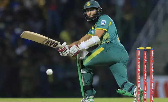 FILE - South Africa's Hashim Amla plays a shot against Sri Lanka during their fourth one-day international cricket match in Pallekele, Sri Lanka, Wednesday, Aug. 8, 2018. (AP Photo/Eranga Jayawardena, File)