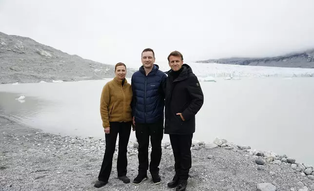 French President Emmanuel Macron, right, Danish Prime Minister Mette Frederiksen, left, and Greenlandic leader Jens-Frederik Nielsen at a glacier in Greenland, Sunday, June 15, 2025. (Mads Claus Rasmussen/Ritzau Scanpix via AP)