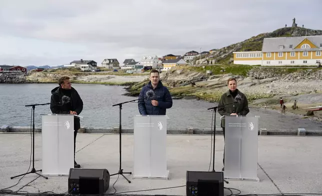 French President Emmanuel Macron, left, Denmark's Prime Minister Mette Frederiksen, right, and the Greenlandic leader Jens-Frederik Nielsen hold a press conference in Nuuk, Greenland, Sunday, June 15, 2025. (Mads Claus Rasmussen/Ritzau Scanpix via AP)