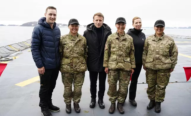 French President Emmanuel Macron, center, Danish Prime Minister Mette Frederiksen, 2nd right, and Greenlandic leader Jens-Frederik Nielsen aboard the Danish frigate F363 Niels Juel in Nuuk, Greenland, Sunday, June 15, 2025.(Mads Claus Rasmussen/Ritzau Scanpix via AP)