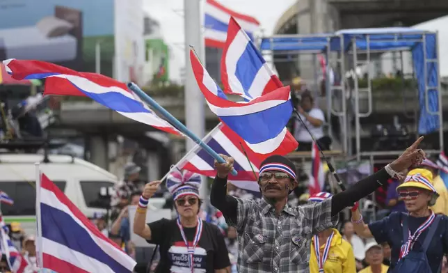 Protesters gather at Victory Monument demanding Thailand's Prime Minister Paetongtarn Shinawatra resign in Bangkok, Thailand, Saturday, June 28, 2025. (AP Photo/Sakchai Lalit)