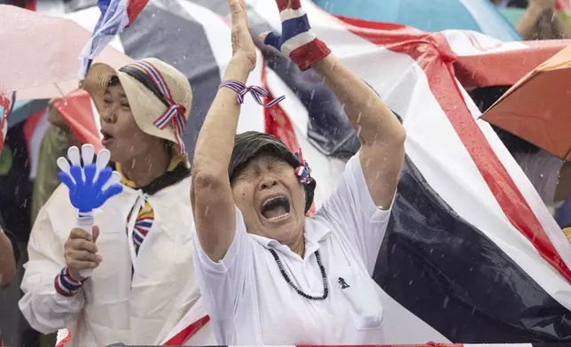 Protesters gather at Victory Monument demanding Thailand's Prime Minister Paetongtarn Shinawatra resign in Bangkok, Thailand, Saturday, June 28, 2025. (AP Photo/Wason Wanichakorn)