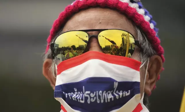 A person attends a protest at Victory Monument demanding Thailand's Prime Minister Paetongtarn Shinawatra resign in Bangkok, Thailand, Saturday, June 28, 2025. (AP Photo/Sakchai Lalit)