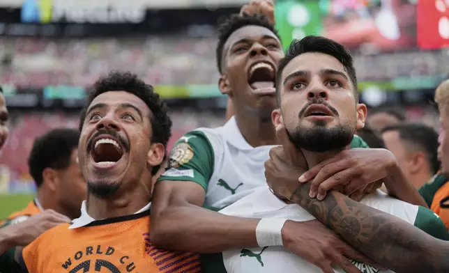Palmeiras' players hug Jose Manuel Lopez, right, after je scored during the Club World Cup group A soccer match between Palmeiras and Al Ahly in East Rutherford, N.J., Thursday, June 19, 2025. (AP Photo/Seth Wenig)