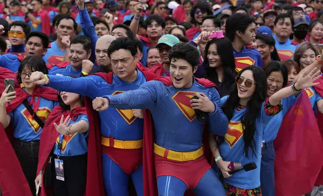 Superman fans dressed in costumes pose during an event as part of the first stop of the Superman World Tour in Pasig city, Philippines on Thursday June 19, 2025. (AP Photo/Aaron Favila)