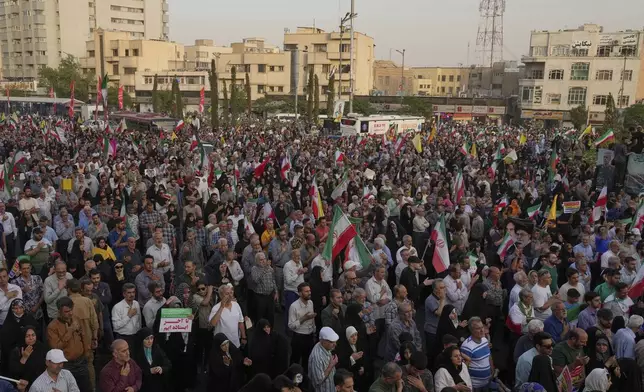 Iranian protesters attend an anti-U.S. and anti-Israeli rally at Enqelab-e-Eslami (Islamic Revolution) square in downtown Tehran, Iran, Tuesday, June 24, 2025. (AP Photo/Vahid Salemi)