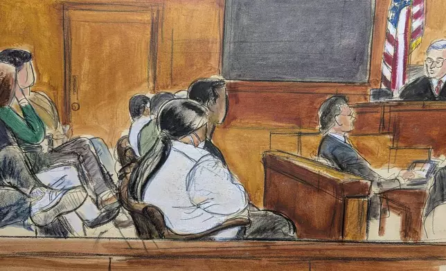 Judge Curtis Farber, right, reads the instructions regarding reaching a unanimous verdict to the jury, Monday, June 9, 2025, at Manhattan criminal court in New York. (Elizabeth Williams via AP)