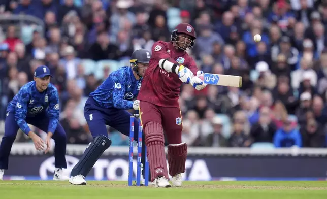 West Indies' Gudakesh Motie hits a six during the third One Day International cricket match between West Indies and England at Oval, London, Tuesday June 3, 2025. (Adam Davy/PA via AP)