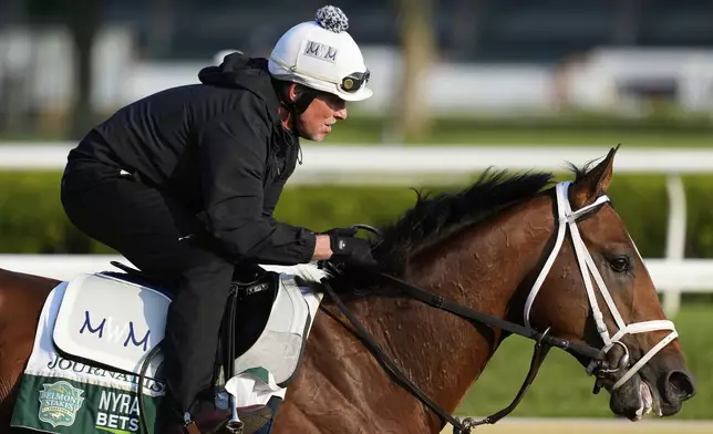 Journalism trains before the running of the Belmont Stakes horse race in Saratoga Springs, N.Y., Thursday, June 5, 2025. (AP Photo/Seth Wenig)