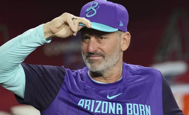 Arizona Diamondbacks manager Torey Lovullo pauses in the dugout prior to a baseball game against the Washington Nationals Friday, May 30, 2025, in Phoenix. (AP Photo/Ross D. Franklin)
