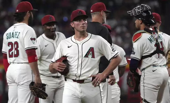 Arizona Diamondbacks pitcher Brandon Pfaadt leaves after giving up nine runs to the Washington Nationals in the first inning during a baseball game, Saturday, May 31, 2025, in Phoenix. (AP Photo/Rick Scuteri)