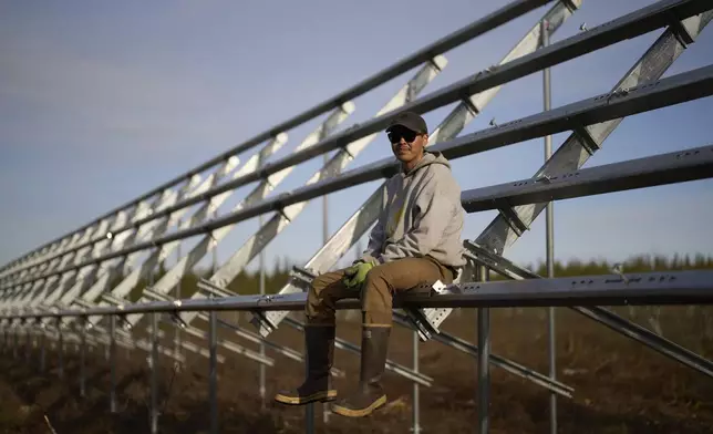 Aaren Sommer poses for a portrait at a construction site of a solar energy project Friday, May 23, 2025, in Galena, Alaska. (AP Photo/John Locher)